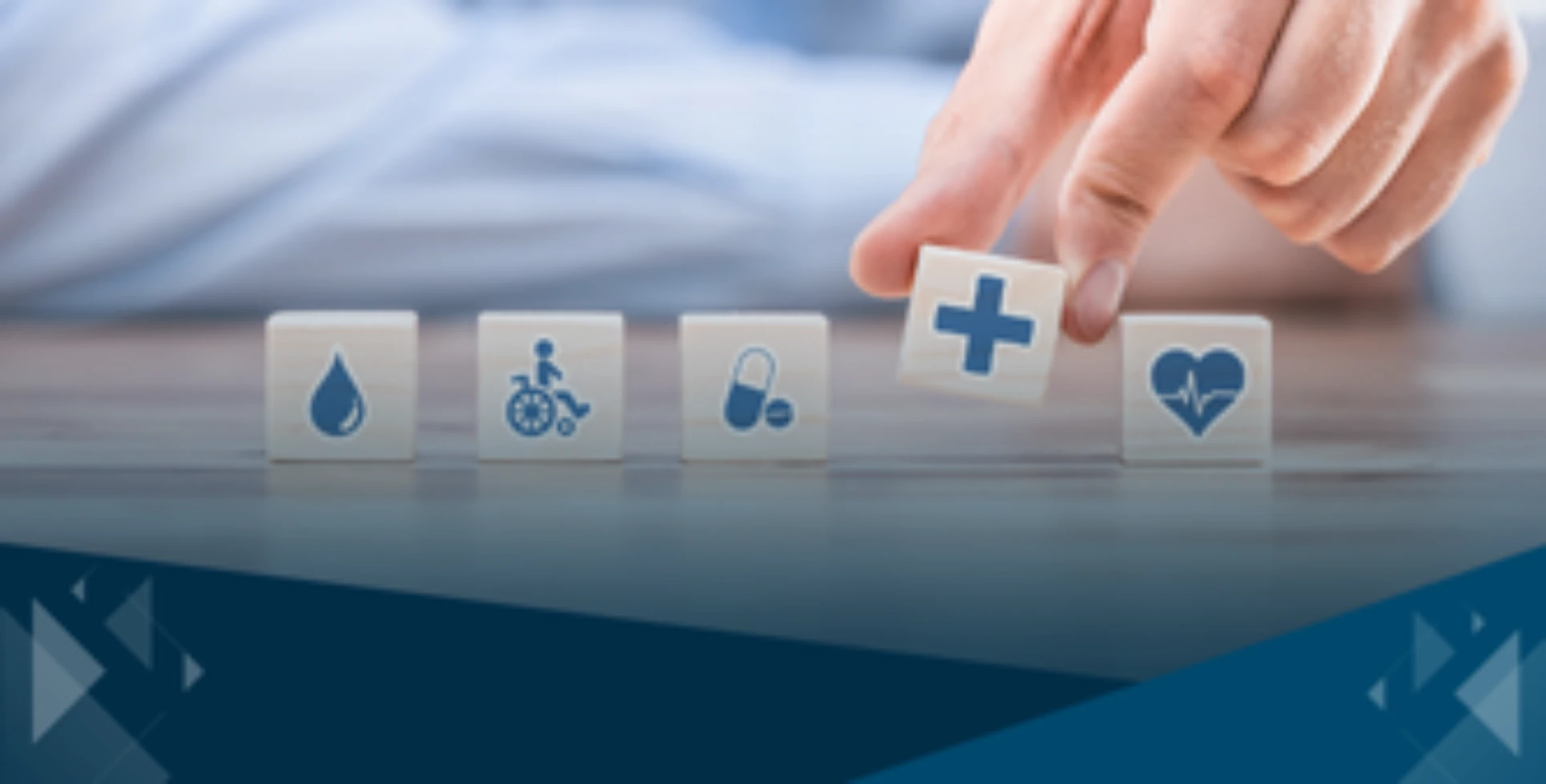 Health insurance icons on wooden blocks representing coverage options